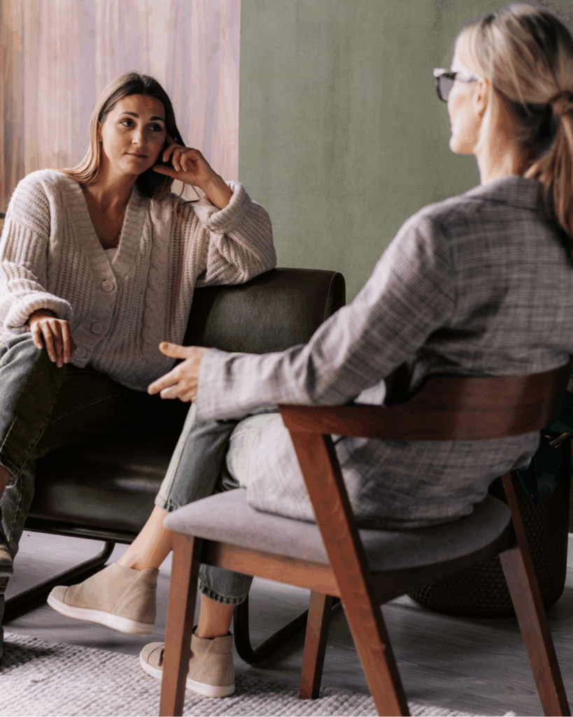 A counselor talking to a patient about food allergy and anxiety